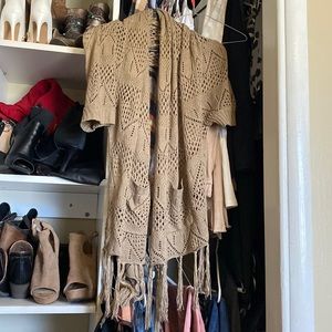 Size m/L made by miracle city. Tan crocheted shawl with pockets and sleeves